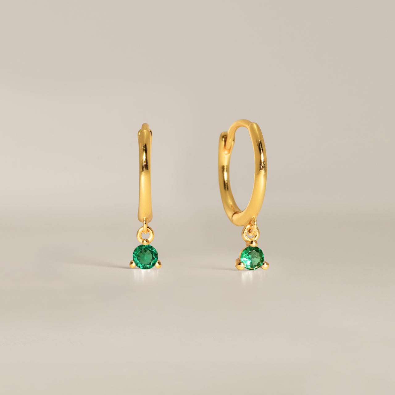 eyrful's emerald elise hoop earrings in gold vermeil.